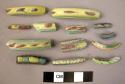 Glass bracelet fragments, colored glass w. pointed and rectangular lugs