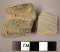 2 Mazandaran gray ware, incised, sherds