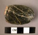 Ground stone object, polished, small, roughly oval, black and white stone