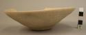 Ceramic bowl, small, undecorated buff ware, shallow, splayed sides,sherd missing