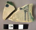 2 potsherds with white glaze with cobalt blue and blue-green painted decoration