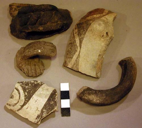 Ceramic handle sherds, black on white, incised, corrugated, perforated