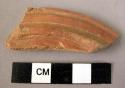 Rim potsherd - red, relief and incised