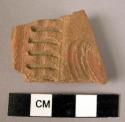 Potsherd - red-brown, relief and incised