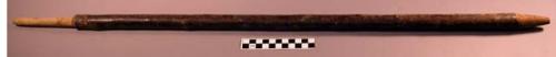 Hollow stick, tapered to conical end, carved stem other end