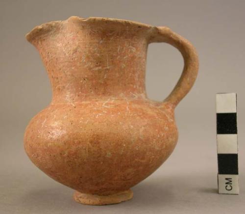 Small trefoil mouth pottery jug with red burnish