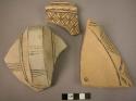 Ceramic rim and body sherds, buff ware w. black painted geometric design [see 41-11-60/7159]