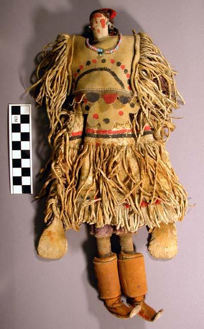 Female doll made of leather and cloth wrapped around wood