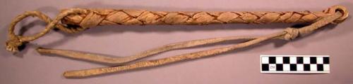 Braided rawhide horse whip.