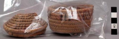 Small basket with cover, coiled. Decorative geometric bands of beige & brown.