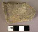 Pottery rim fragment - orange paint traces suggest local copy of Middle Minoan I