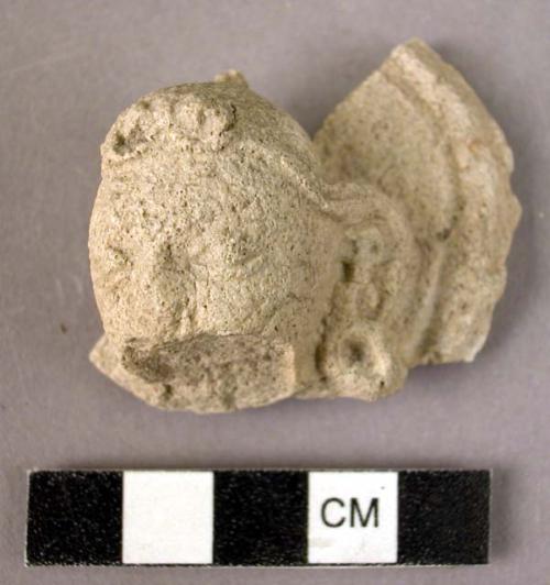 Small plaster buddha head with part of nimbus