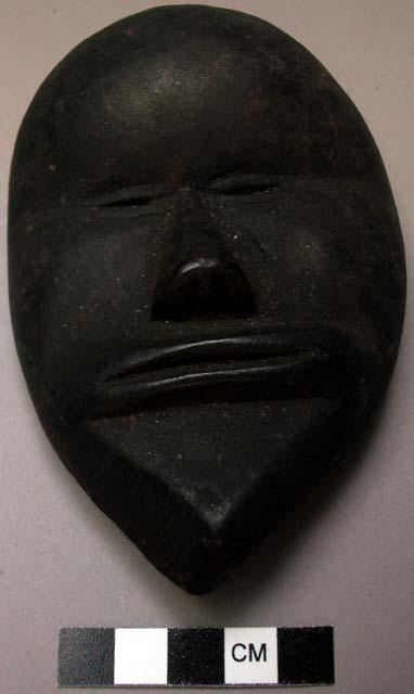 Small wooden mask.  "Si Gbi Glü."  Guard of "Kaso"