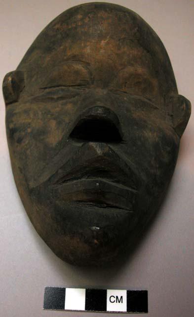 Small wooden face mask.