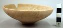 Ceramic bowl, undecorated red ware, shallow, string cut base, mended