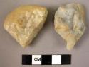 1 fragment of quartzite river pebble - fractured; 1 crude quartzite flake +