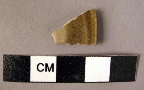 Rim potsherd - brown glaze (Mesopotamia 13th century)