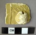Potsherd - yellow glaze with knob handle; Samarra molded pottery