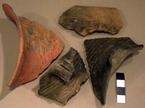 Ceramic rim and body sherds, corrugated, incised, red slip, mended