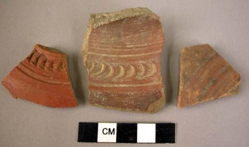 3 potsherds - red-brown, incised