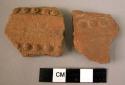 2 potsherds - red-brown, relief