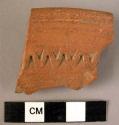 Rim potsherd - red-brown, incised