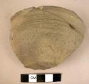 Pottery bowl fragment - gray ware, incised