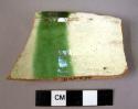 2 rim potsherds - lead glaze, cream, brown and green painted patterns (local)