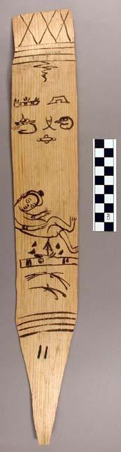 Ornament?, flat stick, black painted designs - human with black spot on hat