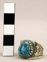 Ring, silver, 1 triangular turquoise stone in a toothed platform , stamped sides
