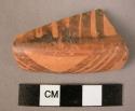 Rim potsherd - with reddish buff slip, burnished and painted