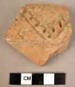 Potsherd - light colored, buff, incised