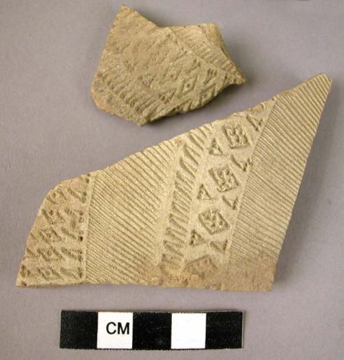 2 Potsherds - light colored, buff slip, incised