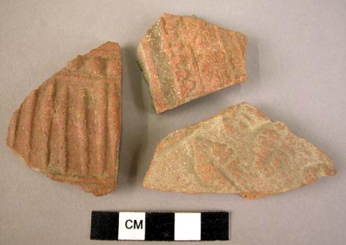 3 potsherds - red-brown, relief, moulded?