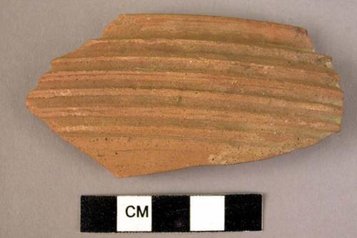 Rim potsherd - brown, ribbed