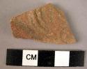 Potsherd - red with stamped relief