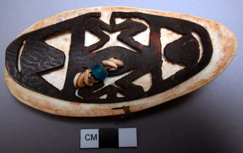 Breast ornament of shell, tortoise shell, tambu, and trade bead