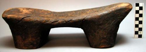 Wooden stool with small legs.  Chetengo