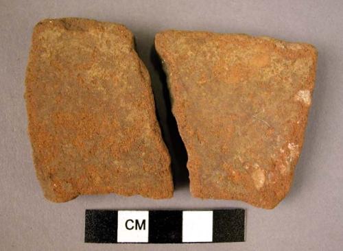 2 potsherds - outer surface red, inner surface black