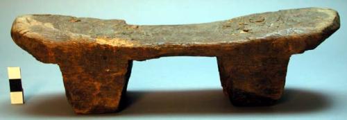 Wooden stool with very small legs.  Ichitengo