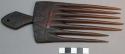 Large comb, dark wood, 7 tines, diamond shaped handle, mapasuli