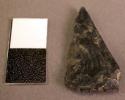 Chipped stone projectile point, triangular, one side broken, obsidian