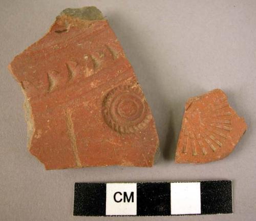 2 potsherds - red-brown, incised and stamped