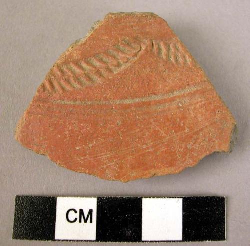 Potsherd - red-brown, incised