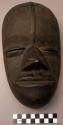 Wooden face mask, one of three