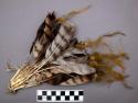 Bundle of feathers attched with string