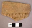 Red ware sherd - double row of deeply incised vertical lines