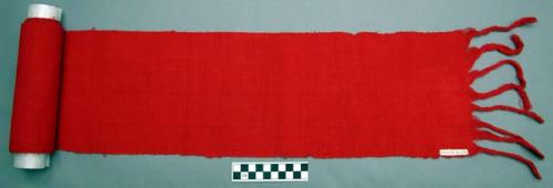 Sash - red cotton plain weave having paired warps and wefts - ends are left unwo