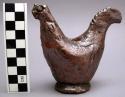 Rooster figurine, hollow with a hole in the center.