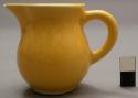 Miniature pitcher, yellow glazed ceramic